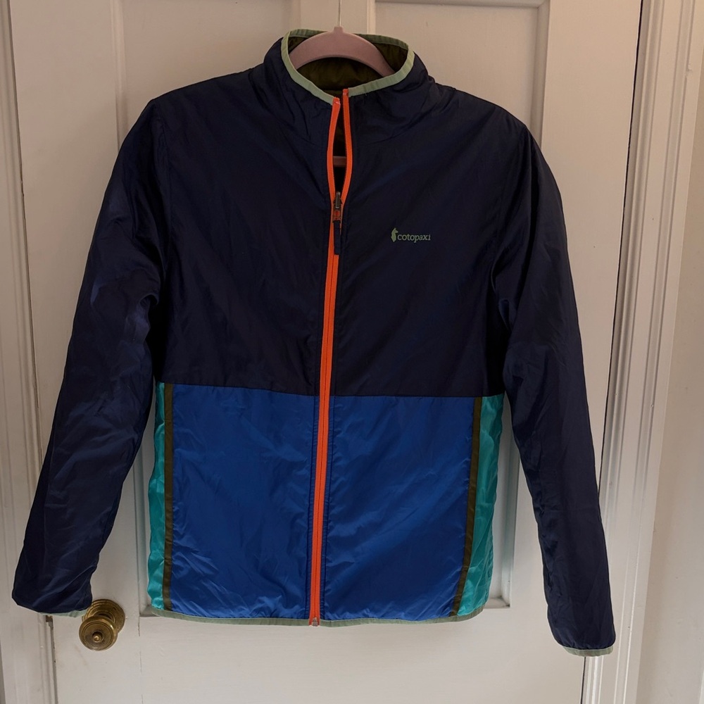 Cotopaxi  boys XL Navy and Blue light Jacket with Orange Zipper and reversible